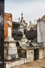 Tombs with statues and busts in an old cemetery, La Recoleta Cemetery in Buenos Aires Argentina