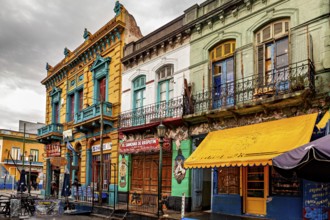 Traditional colourful facades along a cloudy street backdrop, The colourful city and tango district