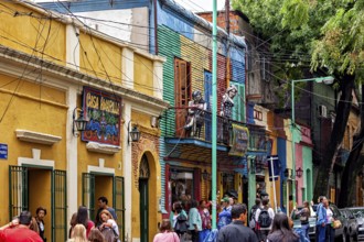 Lively street view with sculptures and colourful buildings in La Boca, the colourful city and tango