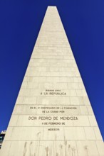 Close-up of an obelisk with engraved inscriptions against a clear blue sky, The great obelisk in
