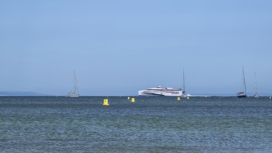 Boats on sea over Knoll Beach Studland, Poole, Dorset, England, United Kingdom