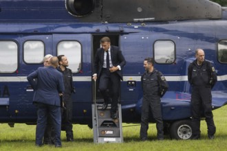 Emmanuel Macron (President of the French Republic) leaves a federal police helicopter in front of a