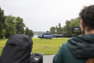 A helicopter with Emmanuel Macron (President of the French Republic) on board in front of a joint