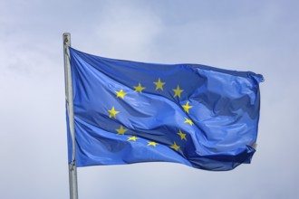 Düsseldorf, North Rhine-Westphalia, Germany - European flag fluttering in the wind on the flagpole,