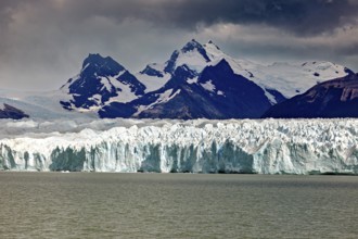 Majestic sight of mountains and glaciers under a gloomy sky, The Perito Moreno glacier in Argentina