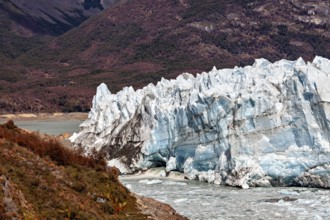 Spectacular ice formations of the glacier with mountain hills in the background, The Perito Moreno