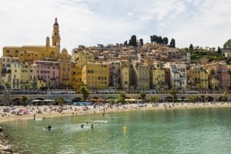 Town with colourful houses by the sea, Plage des Sablettes, Menton, Alpes Maritimes, Provence Alpes