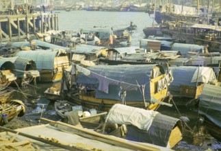 People living on sampan boats in the harbour at Aberdeen, Hong Kong, Asia 1964