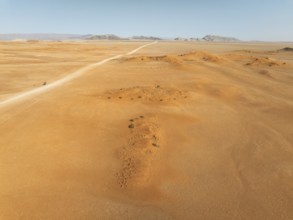 The C14 gravel road at the edge of the Namib Desert. Aerial view. Drone shot. Namibia
