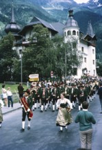People in street procession through village of Oetz, Imst district, Tyrol, Austria, Europe, 1970