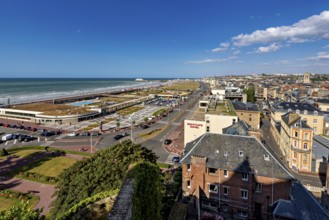 Panoramic view of the town and coast with promenade and hotels under a clear sky, The town of