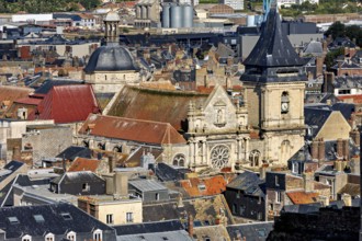 Historic town view with dominating church tower and old brick buildings, The town of Dieppe in
