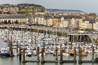 Coastal view of a harbour with numerous boats, lined with historic buildings, The harbour of Dieppe