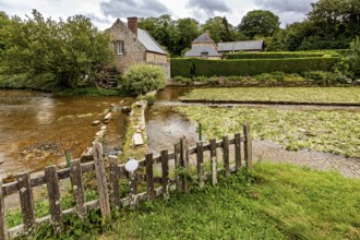 Picturesque landscape with river, old stone bridge and traditional houses in the countryside, the