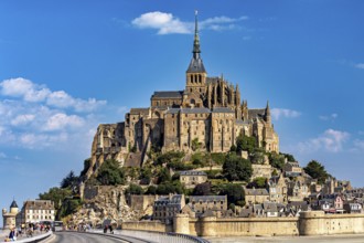 The historic monastery of Mont Saint-Michel against a bright blue sky, Mont Saint Michel in