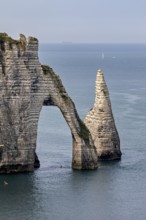 Iconic rock formation with natural arch over the blue sea, The cliffs and alabaster coast of