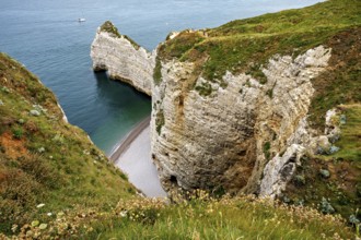 Deep coastal gorge with shallow beach and steep cliffs, The cliffs and alabaster coast of Etretat