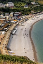 Aerial view of a beach with promenade and people playing, Etretat in Normandy, France