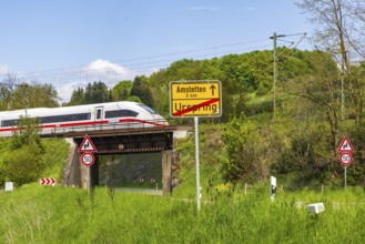 InterCityExpress ICE en route on the Swabian Alb near Lonsee. Landscape with railway bridge near