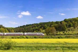InterCityExpress ICE en route on the Swabian Alb near Lonsee. Landscape on the railway's