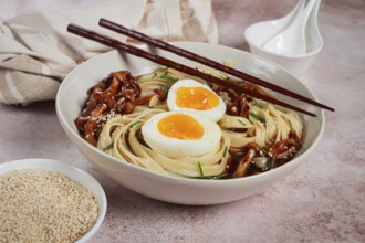 Buckwheat noodles soba with shimeji mushrooms, with boiled egg, green onion, sesame seeds,