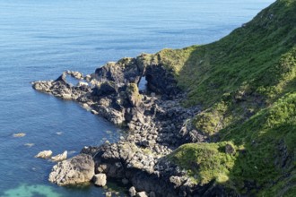 Rocky coast and rock gate on the south-east coast near the southern tip of Cornwall on the English