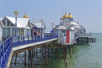 Beach and pier in Eastbourne, seaside resort on the English Channel, in the county of East Sussex,