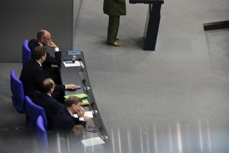 Federal Chancellor Friedrich Merz (CDU) and parts of his cabinet sit on the government bench,