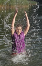 Girls splashing in the lake, Allgäu, Bavaria, Germany, Allgäu, Bavaria, Germany
