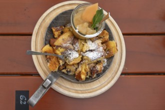 Kaiserschmarrn with apple sauce served in a small pan, Franconia, Bavaria, Germany