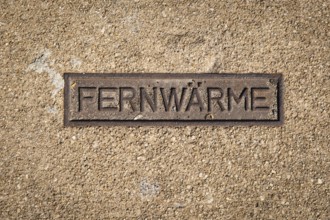 Sign for district heating on a manhole cover in Wuppertal, Germany