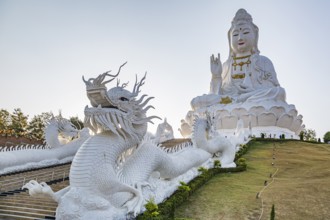 Chinese dragons line the steps up to the Guan Yin (Goddess of Mercy) statue at Wat Huay Pla Kang