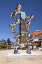 Stainless steel sculpture entitled Points of View by Tony Cragg in front of the Wedding Tower,