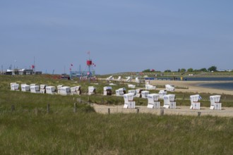 Beach chairs on the family lagoon, Perlebucht, Büsum, North Sea, Schleswig-Holstein, Germany