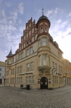 Historic building of the Volksbank with oriel and decorations, corner turret, Luther city