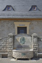 Historic Borlach Tower and museum with fountain and relief by Johann Gottfried Borlach, landmark,