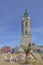 Red Tower with sandy beach, beach and palm tree, landmark, pedestrian zone, market square,