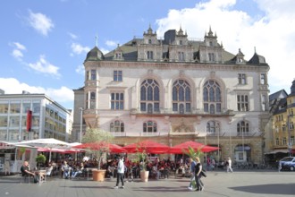 Neo-Gothic town house and street pub, with people and pedestrians, pedestrian zone, market square,