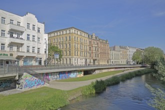 Historic houses on the Robert-Franz-Ring with millrace, stream, bank, Halle an der Saale,