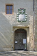 Entrance with coat of arms to the castle and museum, Lützen, Saxony-Anhalt, Germany