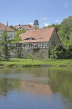 Saale river and historic half-timbered house Neumarktmühle, Saale valley, Merseburg, Saxony-Anhalt,