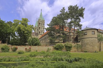 Late Romanesque UNESCO Cathedral of St Peter and St Paul with twin towers and cathedral garden,