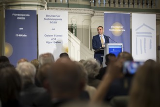 Ugur Sahin (founder of Biontech SE) gives an acceptance speech after receiving the German National