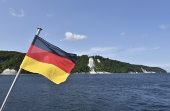 German flag on the Königsstuhl chalk cliff on Rügen, Mecklenburg-Western Pomerania, Germany