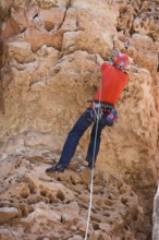 Man rock climbing at The Pit in Sandy's Canyon, Flagstaff, Arizona, USA