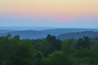 Pink evening sky over a gentle hilly landscape, peaceful nature, Geishöhe, Dammbach, Spessart,