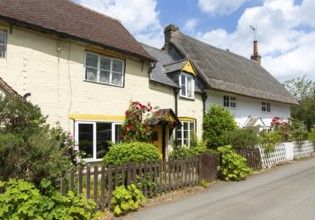 Attractive historic cottages in village of Avebury, Wiltshire, England, UK