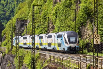 Train of the Austrian Westbahn en route on the winding railway line of the Geislinger Steige.