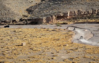 People riding all terrain vehicles through Echo Wash at Echo Bay, Nevada, USA