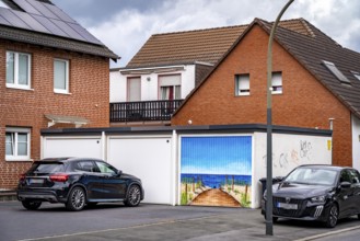 Residential neighbourhood, residential street in Dortmund-Marten, multi-family houses, garages, one